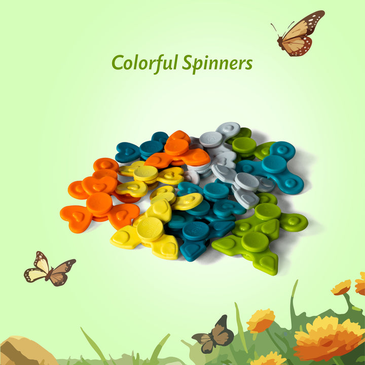 A pile of colorful plastic fidget spinners in orange, yellow, blue, green, and gray, displayed on a light green background with decorative butterflies and flowers. The text 'Colorful Spinners' is written at the top.