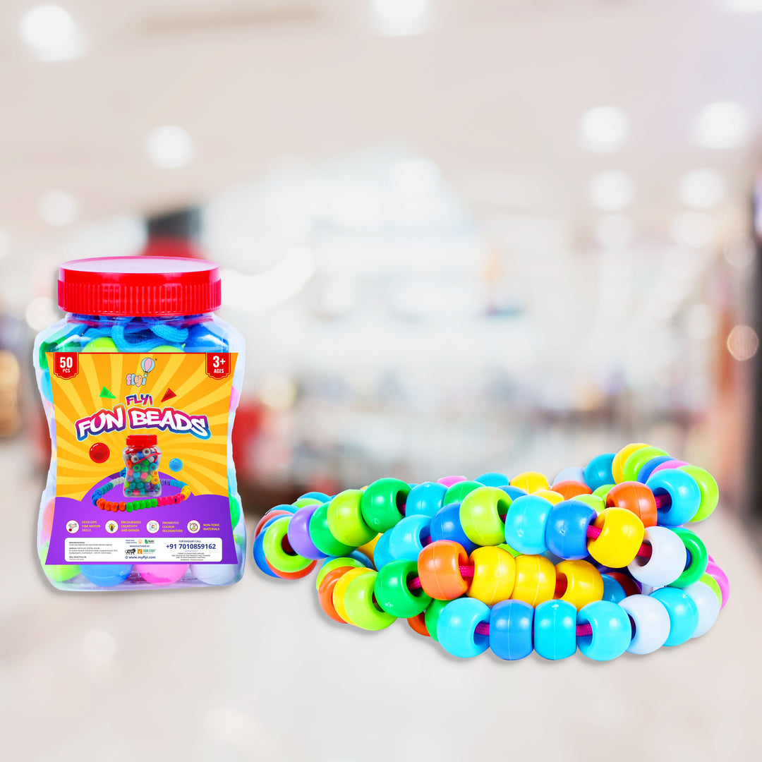 Jar of colorful beads and a bracelet made from them on a blurred background