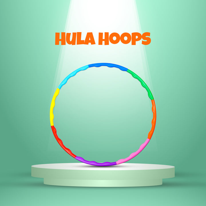 Colorful FLYI hula hoop on a white pedestal with 'Hula Hoops' text above on a green background