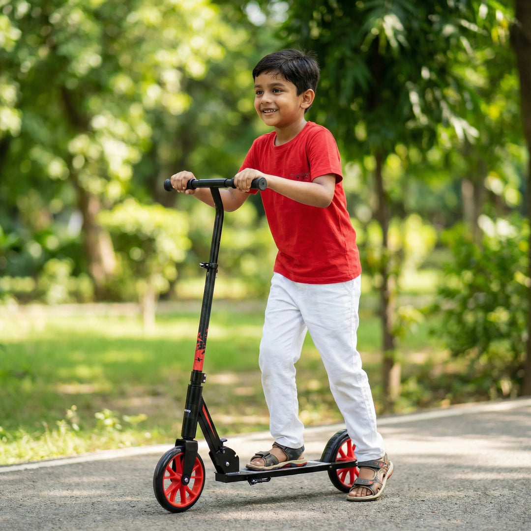 Child riding a scooter in a park with greenery